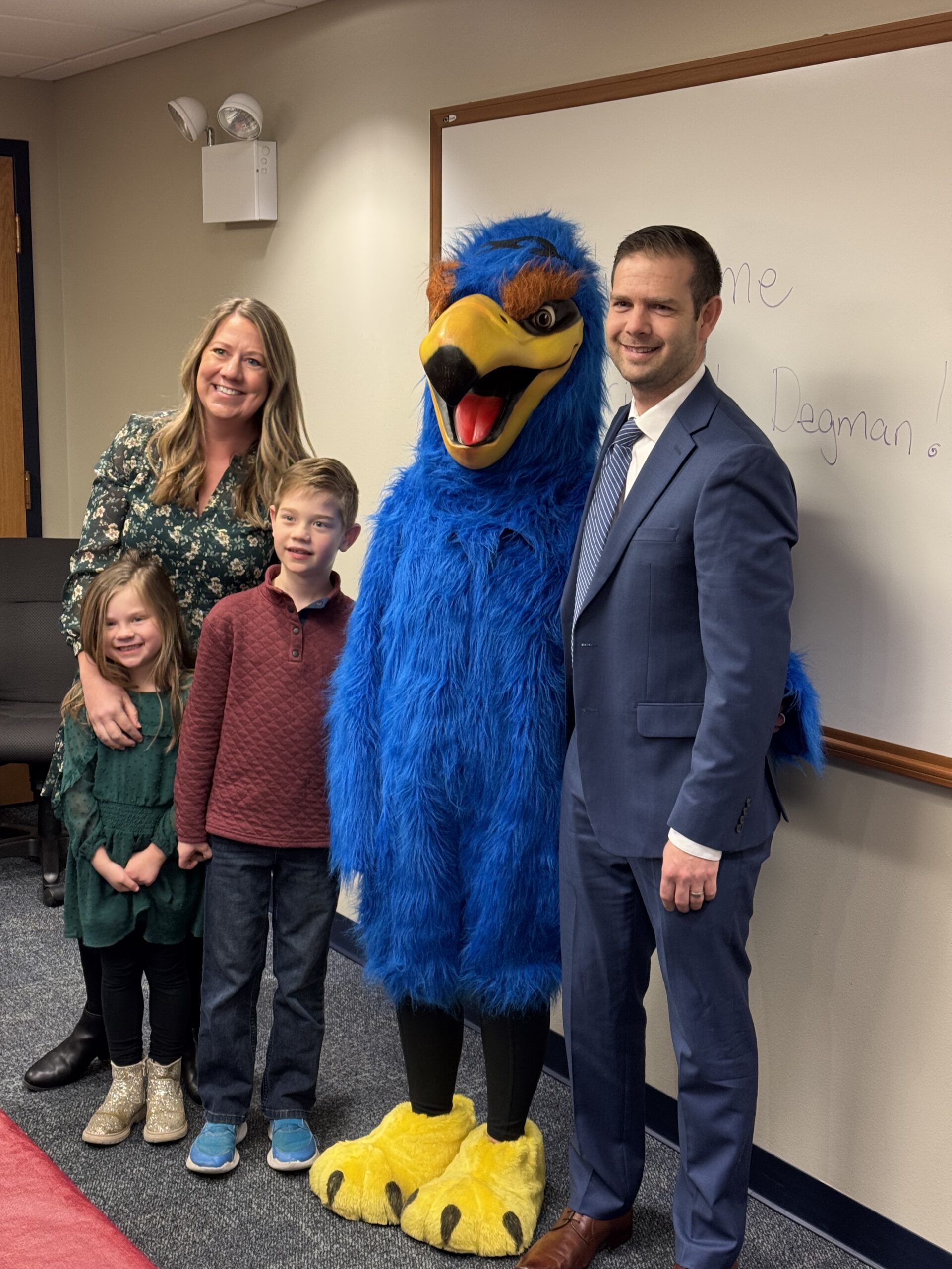 <p>Degman family with HWS mascot Howie the Hawk</p>
